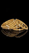 Golden Harmony stack of 6 gold bangles